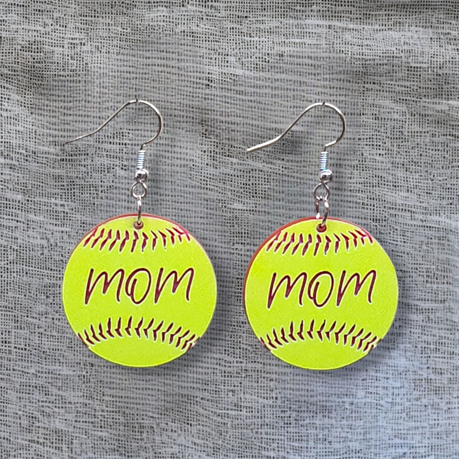 Yellow softball earrings engraved with mom