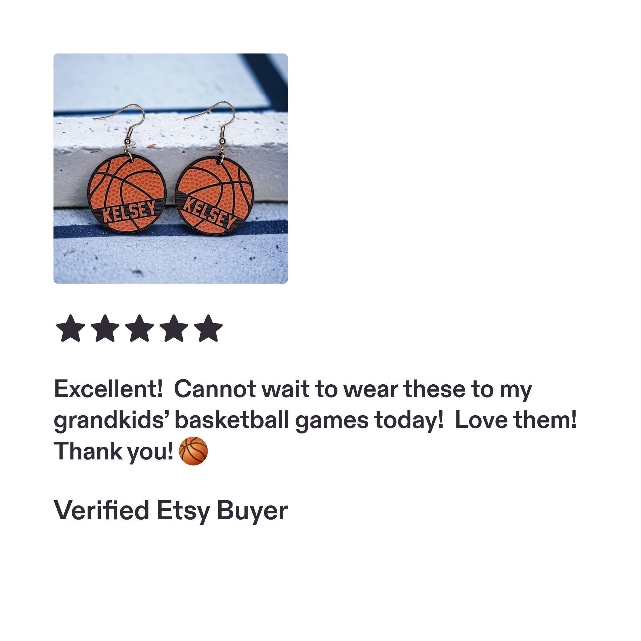 Personalized KELSEY basketball earrings on a windowsill.